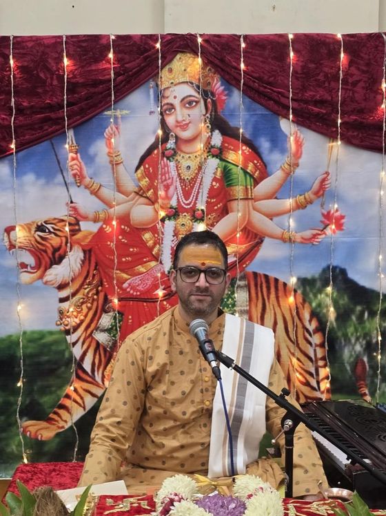 Pandit Deepak Thapliyal performing a puja with harmonium